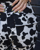 Bei PICK UP in Düsseldorf findest Du Run & Fly, Black & White Cow Print Straight Leg Trousers  und viel mehr von RUN & FLY